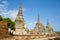 A sunny morning at the ancient stupas of the Buddhist temple of Wat Phra Si Sanphet. Ayutthaya, Thailand