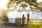 On a sunny morning, a mother and her son are bathed in the sunshine in front of Niagara Falls.