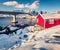 . Sunny morning scene of Hamnoy village with bridge over Vorfjorden fjord.