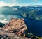 Sunny morning view of popular Norwegian attraction Preikestolen. Great summer scene of the Lysefjorden fjord, located in the Ryfyl