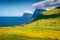 Sunny morning view of Trollanes village, Kalsoy island. Attractive summer scene of Faroe Islands