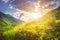 Sunny mountains landscape. Mountain range and yellow sunlight on grassy hills. Amazing sunset in highlands