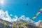 Sunny Peak View in Himalaya Mountains buddhist Flags and Crow
