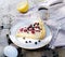 Sunny Photo with a morning breakfast in rustic style. Cheesecake raspberries and blueberries on wooden table.
