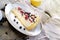 Sunny Photo with a morning breakfast in rustic style. Cheesecake raspberries and blueberries on wooden table.