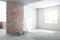 Sunny renovation room in light apartment with brick and white walls and ladder with buckets on concrete floor