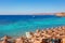 Sunny resort beach with palm tree at the coast of Red Sea in Sharm el Sheikh, Sinai, Egypt, Asia in summer hot. Ð¡oral reef and