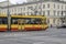 Sunny ride exploring warsaw on a modern yellow tram