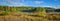 Sunny roadside view of marsh and woodland wilderness country. Warm summer day in boreal forest wilderness in Ontario Canada.