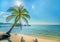 Sunny seascape with tropical palms on beautiful sandy beach in Phu Quoc island, Vietnam