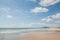 Sunny seaside scenery, fine white sand, blue sky and white clouds