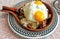 Sunny Side Up Eggs over Hash in Skillet