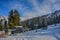 Sunny Ski Slope and Ski Lift near forest