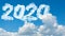 Sunny sky cloud year 2020. Happy New year concept. Numbers 2020 symbol inscription on background of blue sky from white smoke of