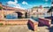 Sunny spring cityscape of Bosa town with Ponte Vecchio bridge across the Temo river. Captivating morning view of Sardinia island,