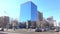 Sunny spring Moscow street 4K video with mirror building and road traffic