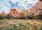 Sunny spring scene of Cappadocia. Picturesque morning view of of Red Rose valley in April. Cavusin village located, district of Ne