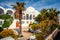 Sunny spring view of garden at Fira Orthodox Cathedral. Colorful morning scene of the famous Greek resort - Santorini, Greece,