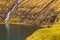 Sunny spring view of Saksun village with typical turf-top houses, Faroe Islands