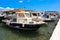 Sunny summer day and beautiful fishing boats in the port of Elafonisos village island, Laconia, Peloponnese, Greece June 2018.