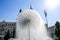 Sunny summer day. Beautiful fountain with splashes of water on the main street of Kiev. Close-up.