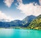 Sunny summer landscape with small yacht on Lungerersee lake