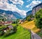 Sunny summer view of great waterfall in Lauterbrunnen village. Splendid outdoor scene in Swiss Alps, Bernese Oberland in the canto
