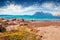 Sunny summer view of Tavolara island from Spiaggia del dottore beach.