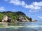 Sunny tropical sandy beach, blue waters, palms. Anse Source d\\\'Argent, La Digue island, Seychelles