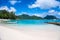 Sunny tropical white sandy beach of French Polynesia