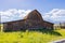 Sunny view of the John Moulton Barn and Teton Range