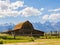 Sunny view of the John Moulton Barn and Teton Range