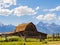 Sunny view of the John Moulton Barn and Teton Range