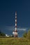 Sunny view for transmitter on Gaisberg hill over Salzburg city in summer evening