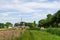 Sunny windmill and bridge landscape