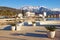 Sunny winter day. Montenegro, view of embankment of Tivat city and snowy peaks of Lovcen mountains