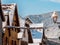 Sunny winter day. Snow-covered roofs of houses. Village in Alsace