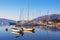 Sunny winter Mediterranean landscape. Yachts and fishing boats on the water. Bay of Kotor, Tivat, Montenegro