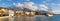 Sunny winter in Mediterranean town. Panoramic view of the embankment of Tivat city