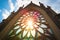 sunrays streaming through a gothic revival rose window casting vibrant colors