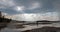 Sunrays and sunbeams above steam rising off Hot Lake in the Lower Geyser Basin in Yellowstone National Park in Wyoming USA