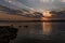 Sunrays after sunset in San Ignacio, Misiones, Argentina, with little mountains in the horizon and the river shore at the left