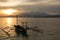 Sunrise above volcano Rinjani with fishing boat, L