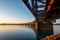 Sunrise across Tauranga harbour catches historic railway bridge