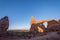 Sunrise in Arches National Park at Turret Arch. blue sky