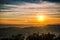 Sunrise backlit sky with cloud on the top of mountain