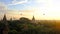 Sunrise in Bagan top view with hot air ballooons flying on a horizont