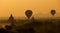 Sunrise balloons over Bagan.