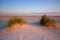 Sunrise on the Baltic Sea coast, sand dunes, beach, Kolobrzeg, Poland.