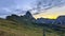 Sunrise bathes Seceda in warm light, autumn colors burst